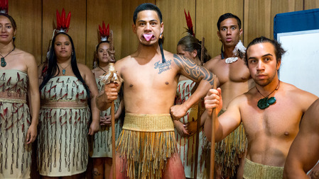 maori tribe group with feathers in hair