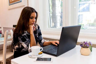 Woman on laptop in office