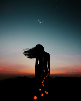 cosmic woman looking at moon