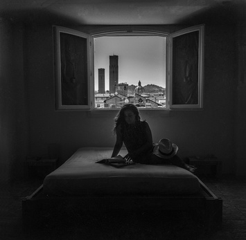 woman alone on bed