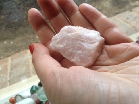 healing rose quartz crystal with high vibrations, held by Natalia Kuna