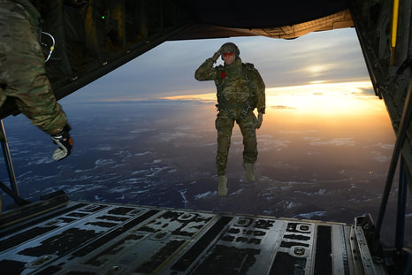 soldier leaping out of plane