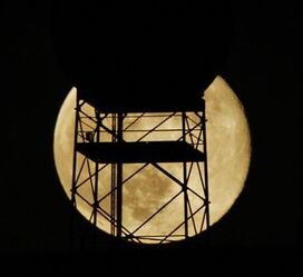 super moon in front of tower