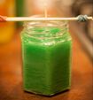 green candle in jar