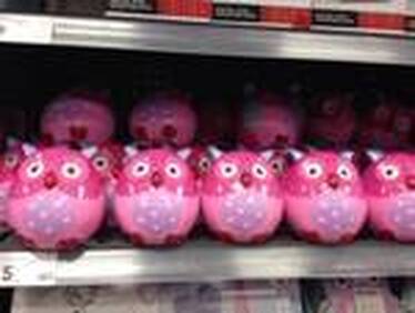 pink owl figures on store shelf