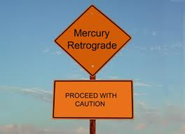 mercury retrograde 'proceed with caution' road sign