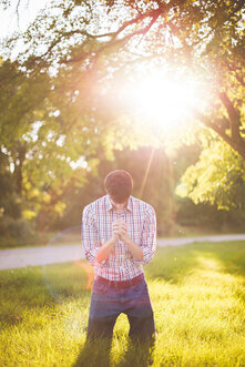 man praying to God, Spirit outside with shining light