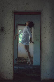 woman levitating, lucid dreaming in doorway