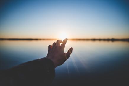 hand healing absorbing sun light energy rays