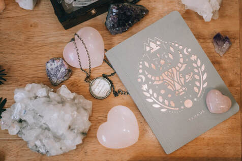 sacred table with journal and crystals