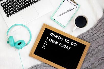 desk with 'things to do today' sign
