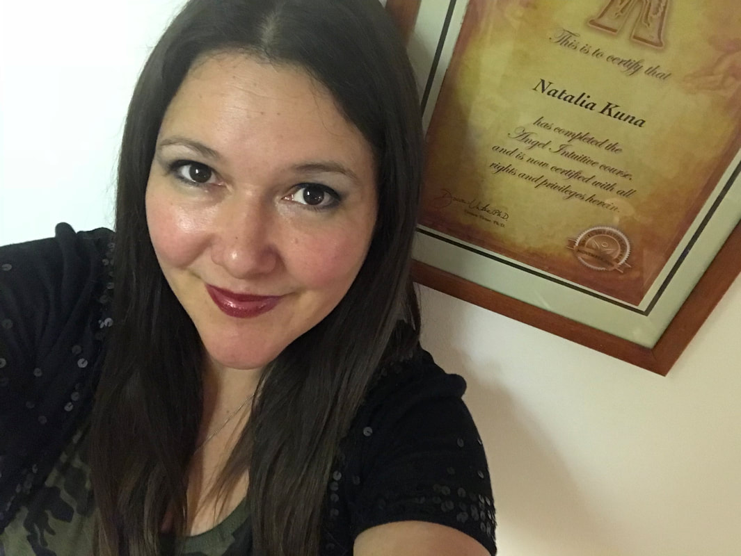 Natalia Kuna in front of her Angel Intuitive Certificate, certified by Hay House