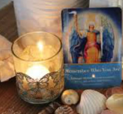 angel oracle card and candle sacred space