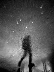 man walking in moon shadows, black and white