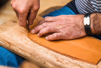 man crafting wood