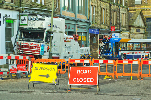 road signs 'diversion' and 'road closed'