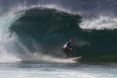 man surfing in big wave