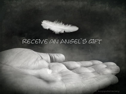 feather falling on hand 'receive and angels gift'text
