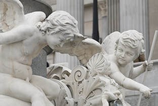 angel cherubim statues on building
