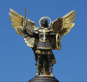 archangel michael with shield and sword statue