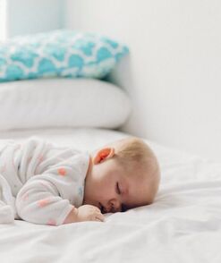 baby on white bed