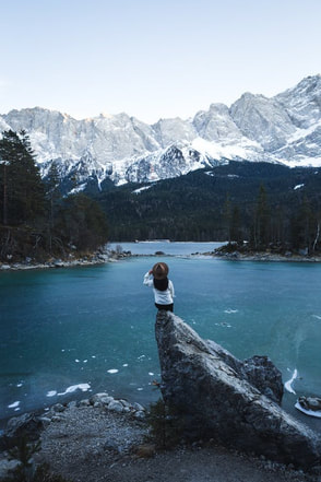 spiritual woman looking at beautiful lake mountain view