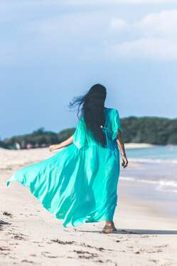 spiritual woman walking on beach